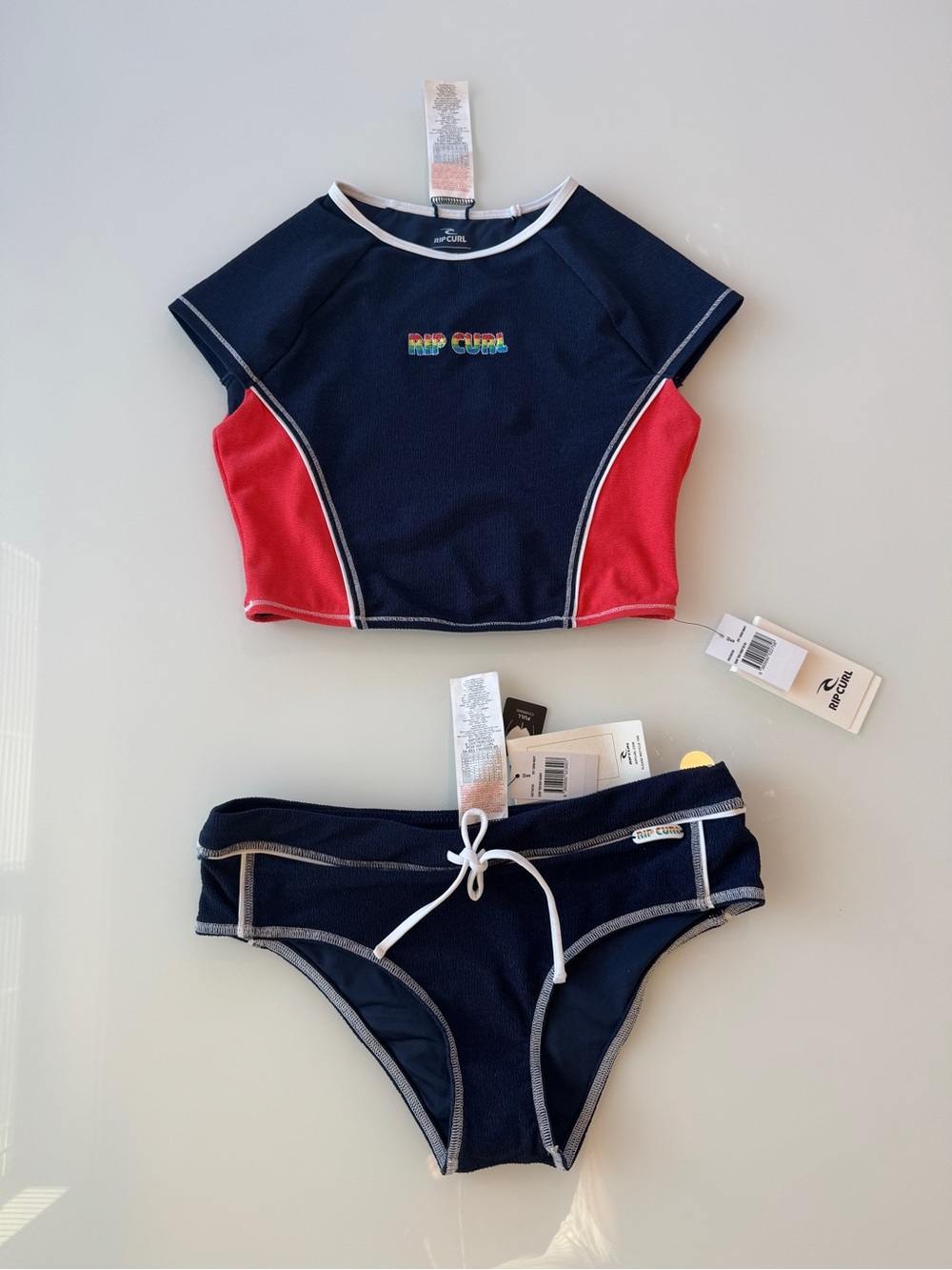 Rip Curl Surf Tide rash guard bikini set - Navy & Coral NWT